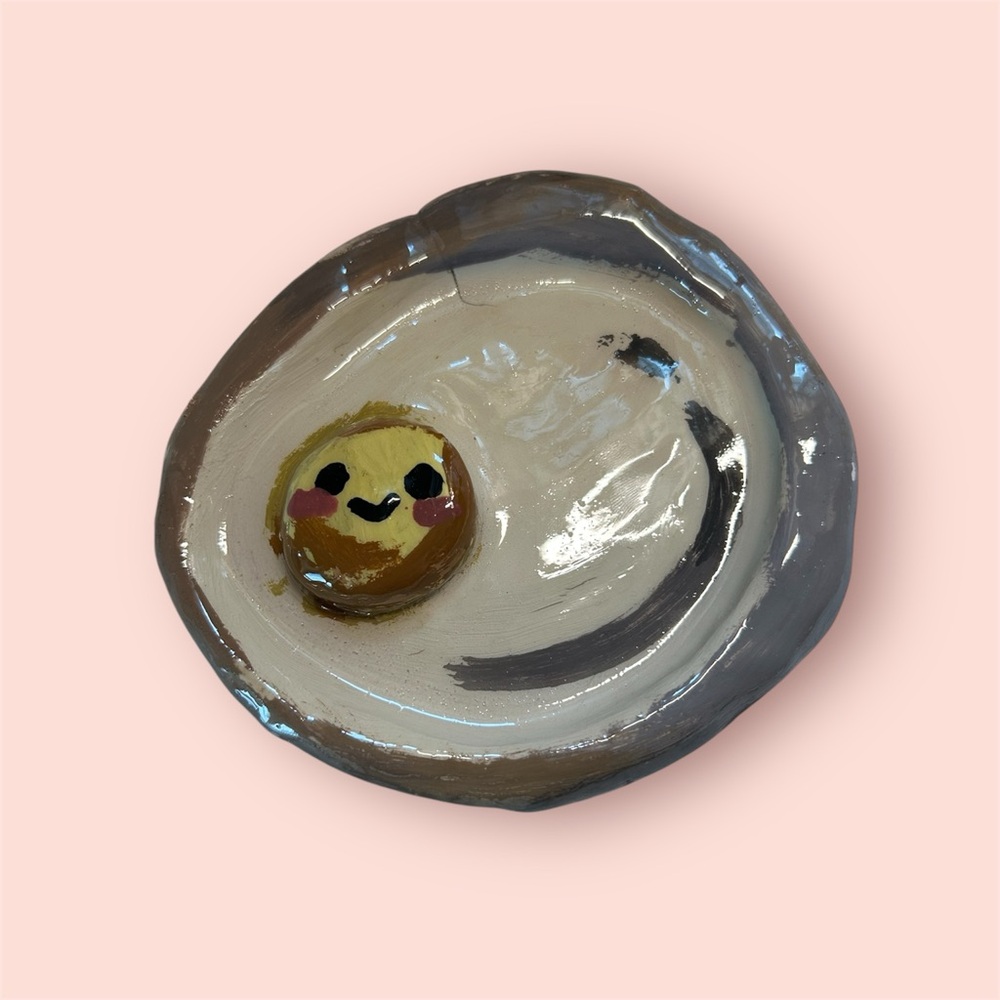 Cream and Brown Ceramic Art with Whimsical Designs